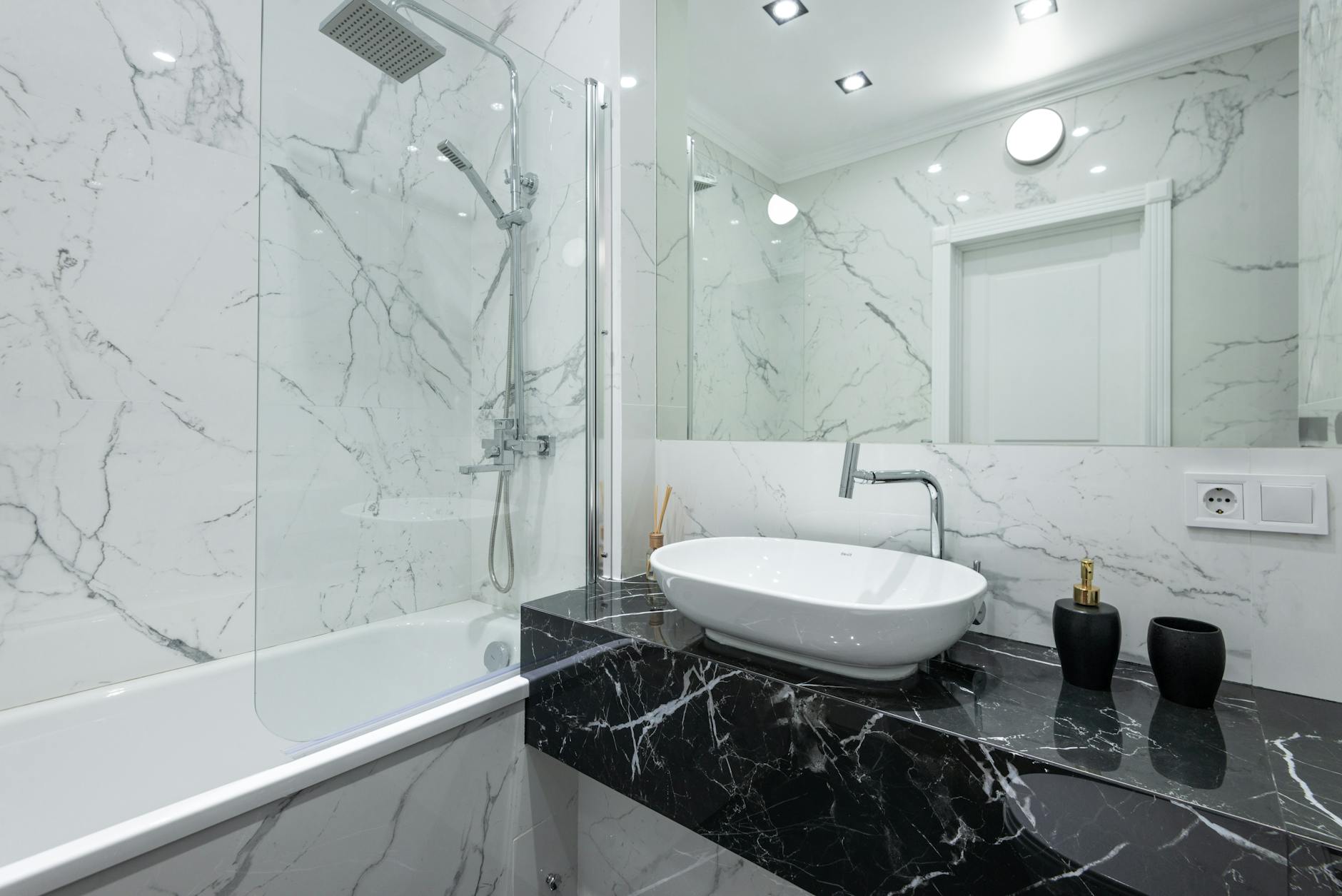 A bathroom decor visual with mirror styling, towels, and simple accents